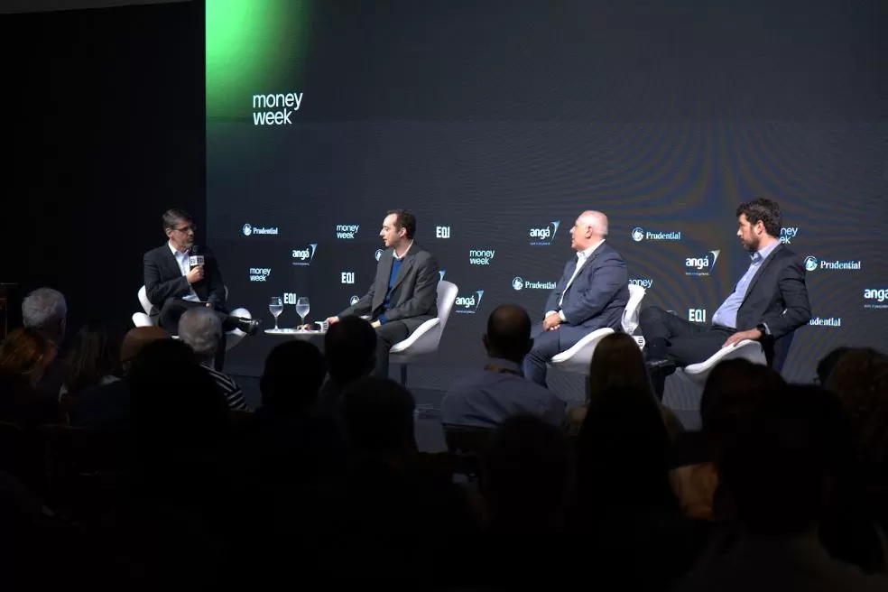 foto economistas na Money Week: cenário de juros