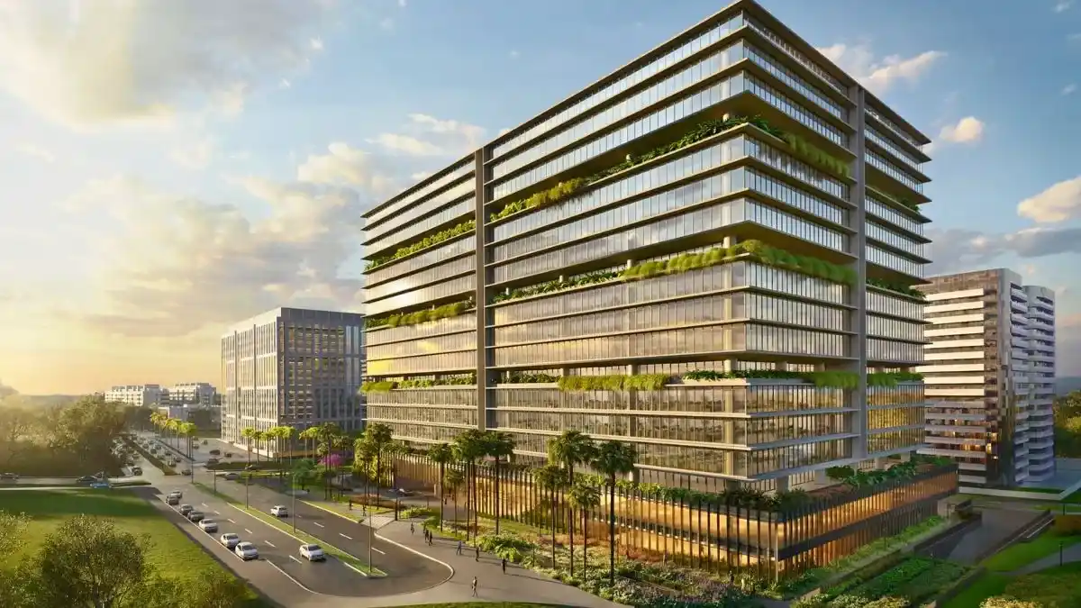 Edifício de escritórios moderno, com fachada de vidro e área verde, no complexo corporativo Lotus Tower em Brasília